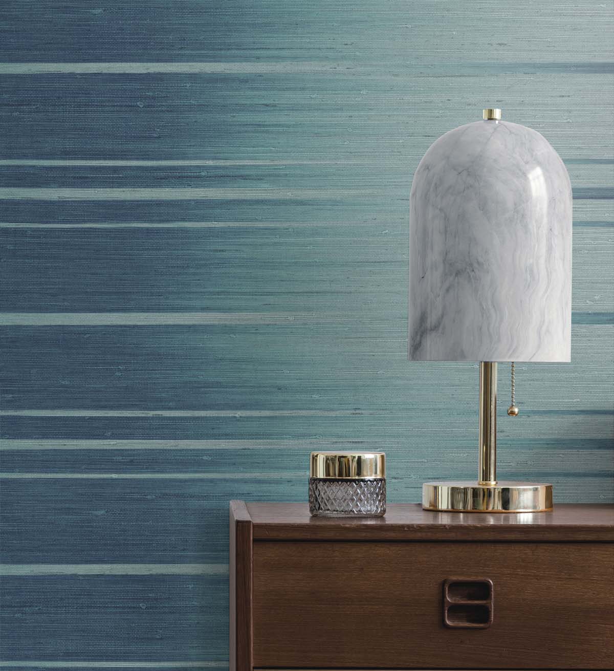 Blue vinyl wallpaper with desk lamp atop desk