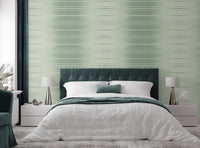 Ombre green grasscloth wallpaper in a bedroom setting