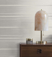 Gray Grasscloth Wallpaper Embossed on a desk with a desk lamp